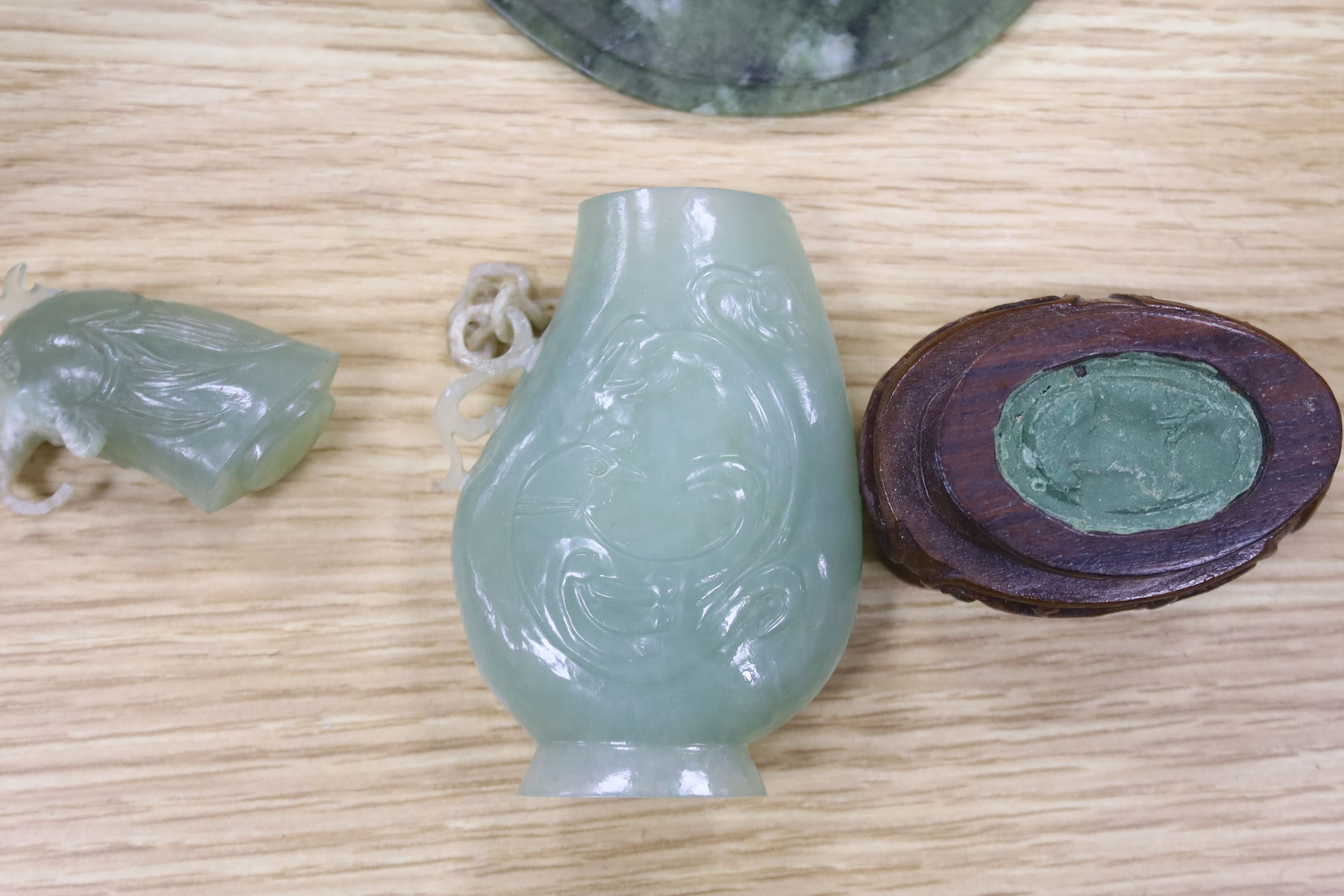 A group of Chinese hardstone and soapstone vessels and boulder carvings, largest 23cm